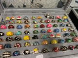 a display case filled with lots of colorful rings