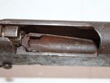 a close up of a gun that is on a table