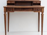 a wooden desk with a drawer on top of it