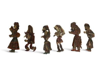 many figurines of people walking together in a line