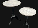 pair of marble top side tables on cast iron bases