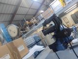 a large room with many boxes and a clock on the wall