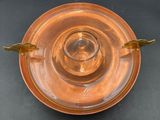 a glass plate with a gold rim and two gold wings on it