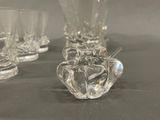 a lot of glasses that are sitting on a table
