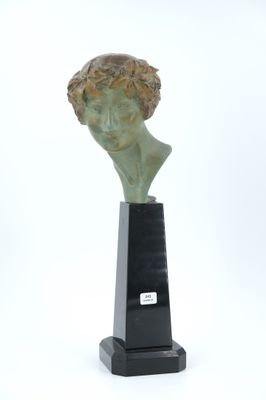 sculpture of a bust of a man on a black pedestal