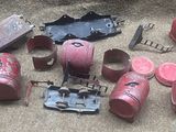 a lot of red fire extinguisors and other items on the floor