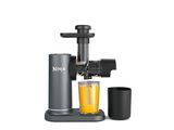 an image of a juicer with a glass of orange juice next to it