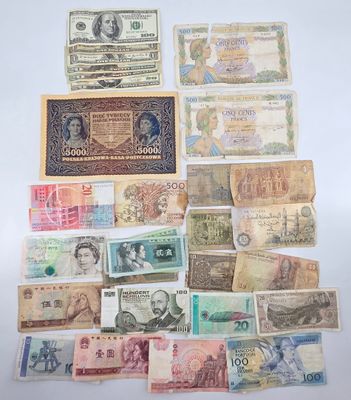 many different types of paper money on the table