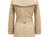 a women ' s trench coat on a mannequin mannequin mannequin mannequin mannequin mannequin mannequin mannequin
