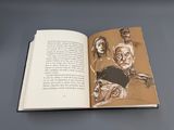 un livre ouvert avec le dessin d'un homme et d'une femme
