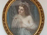 un tableau représentant une femme portant un voile, accroché au mur