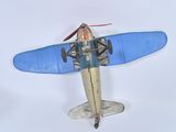 a toy airplane that is sitting on a white surface