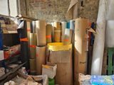 many rolls of paper and boxes in a room