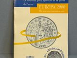 un livre sur lequel est posée une pièce de monnaie