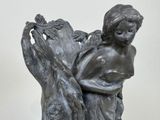 a statue of a woman holding a baby in her arms