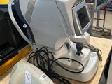 an image of a medical device sitting on top of a wooden table