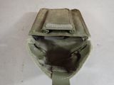 a small bag with a zipper on it on a white surface