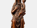a statue of a woman holding a child in her arms