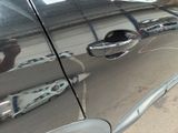 a reflection of a person in the side mirror of a car