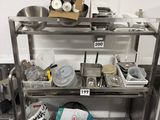 a metal shelf that has a bunch of items on it