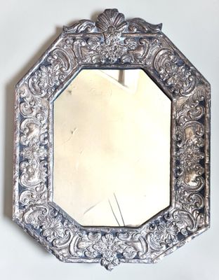 a mirror that is hanging on the wall in the room