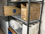 many rolls of toilet paper on the shelves in the room