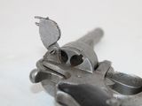 a small gun that is sitting on a table