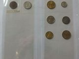 a lot of coins in a plastic bag on a table