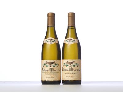 two bottles of wine sitting on top of a white table