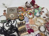 many different types of jewelry on the table together