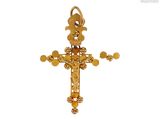 une image représentant une croix en or surmontée d'une fleur