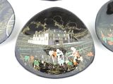 three decorative plates with decorative designs on them on a white surface