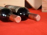 three bottles of wine sitting next to each other on a table