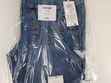 a close up of a pair of jeans wrapped in plastic