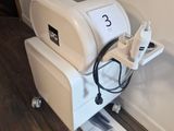 a machine that is sitting on the floor next to a wall