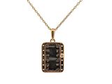 a gold plated necklace with a black stone pendant on a chain