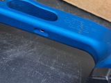 a blue wrenet sitting on a table next to a box