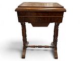 an old wooden table with a drawer on top of it