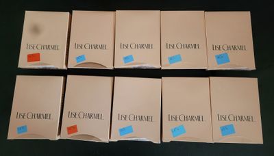 several boxes of cigarettes sitting on top of a black table