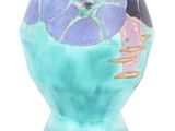 a blue vase with a picture of a woman on it