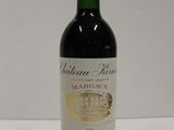 a bottle of wine that is sitting on a table