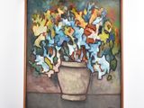 un tableau de fleurs dans un vase sur le mur