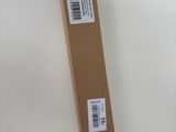 a box that is sitting on the floor next to a pair of shoes
