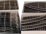 three boxes with different types of train tracks in them