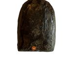 an image of a rock with a button on it