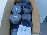 a box full of plastic containers sitting on the ground