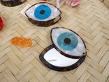 a picture of a pair of eye shaped mirrors on the floor