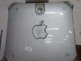 an apple laptop sitting on top of a cardboard box