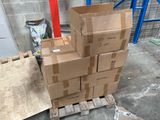 a stack of cardboard boxes on a pallet in a warehouse
