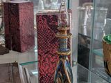a glass display case with various glass items on it